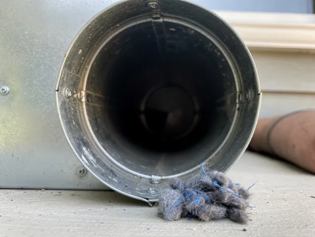 Danbury Dryer Vent Cleaning technician using specialized equipment to clear severe dryer vent blockage in Danbury